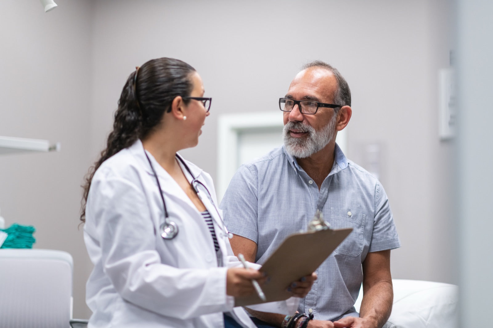 A doctor discussing balance symptoms with a smiling patient